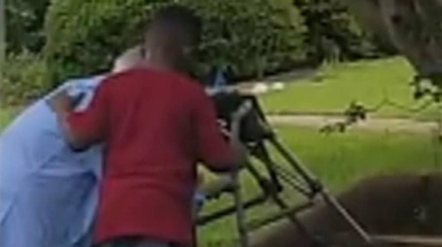 Georgia boy helps senior citizen up stairs