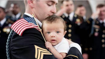 Newborn daughter of late Army specialist poses for photo shoot with dad’s fellow soldiers