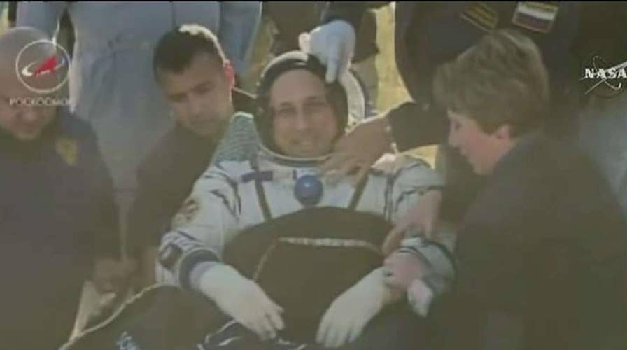 Three astronauts return home from the ISS