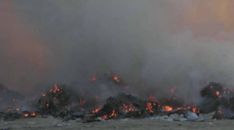 Military accused of inaction on burn pit side effects