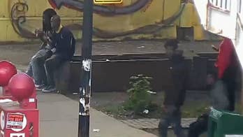 Chicago man killed by police had gun, officials say; investigator says he was shot in the back