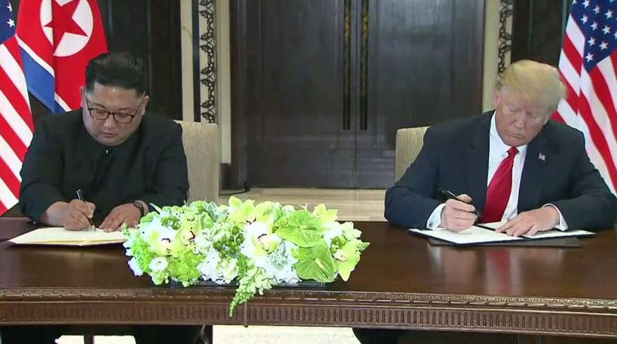 Trump and Kim sign 'comprehensive' document