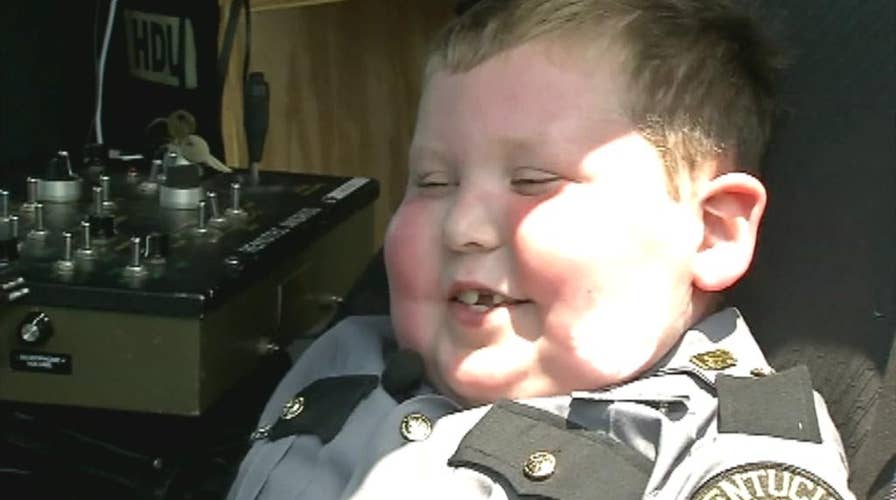 Child battling terminal cancer is granted wish of becoming a police officer