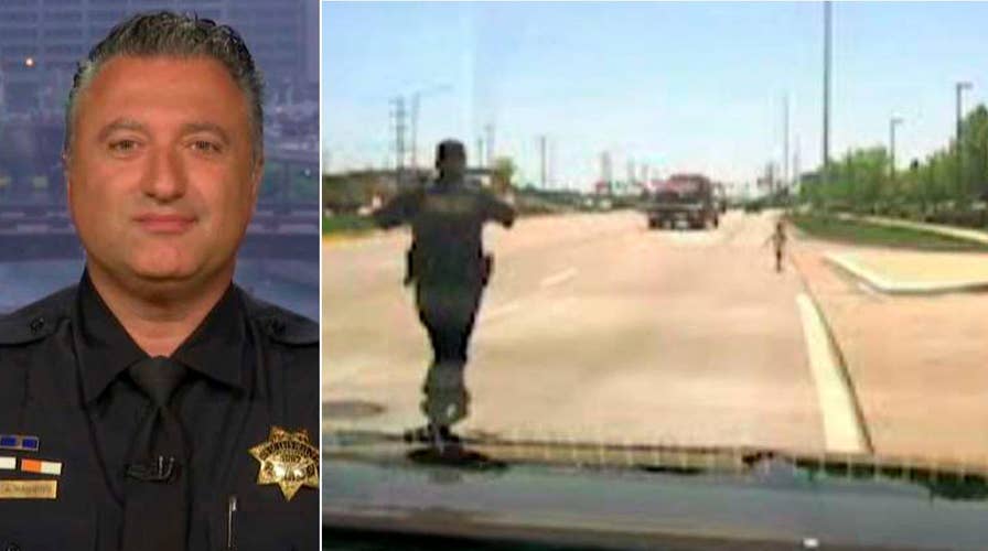 Hero cop saves toddler wandering into traffic