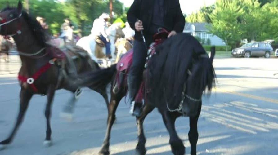 Rider arrested after rogue horse tramples boy at parade