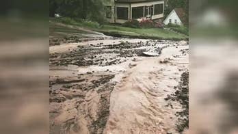 Michigan floods wash away roads, create dozens of sinkholes as residents remain stranded