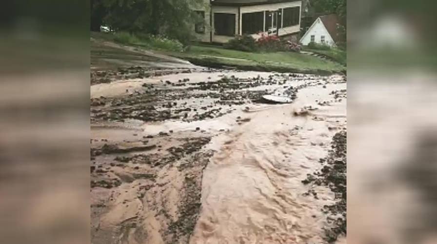 Flash flooding in Michigan rips apart roadways