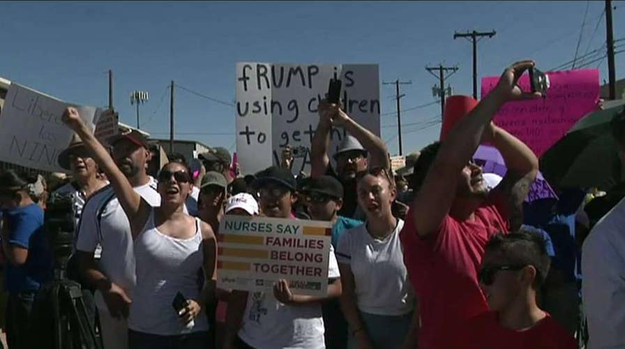 Protesters march to border migrant facility
