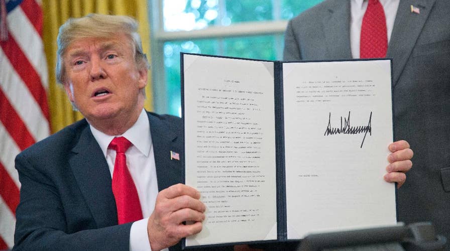 Trump signs order halting separation of families at border