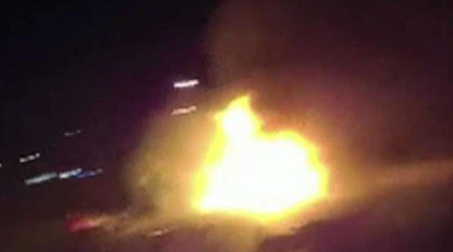 Troopers rescue driver from fiery crash