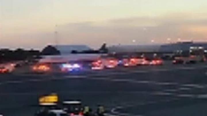 Police surround plane at New York's JFK airport