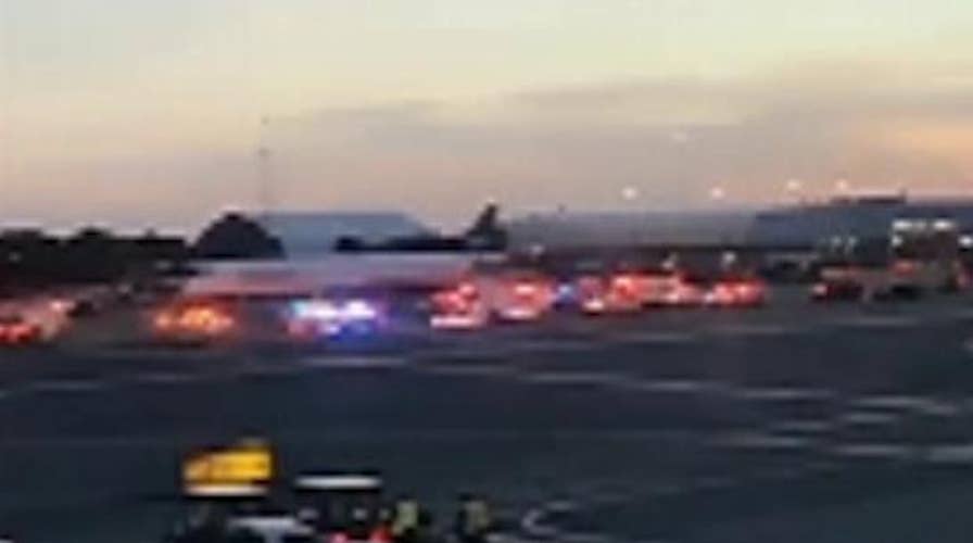 Police surround plane at New York's JFK airport