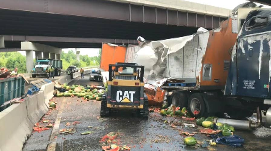 Raw video: Tractor-trailer carrying watermelons overturns