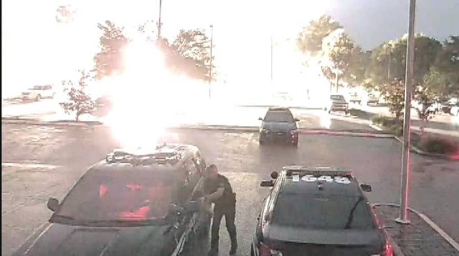 Lightning strikes feet away from police officer