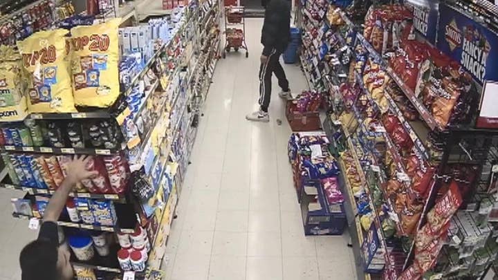 Owner defends store against robbery attempt by man with ax