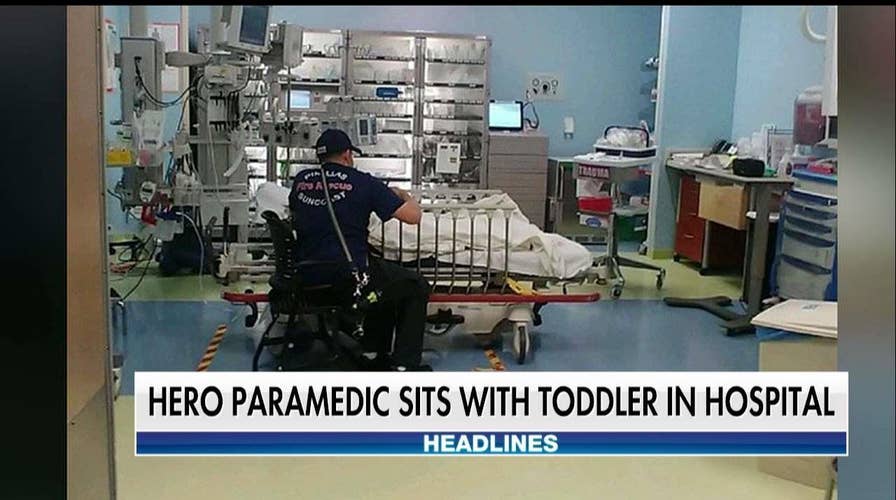 Touching Photo Shows Paramedic Waiting in Hospital With Toddler He Helped Revive