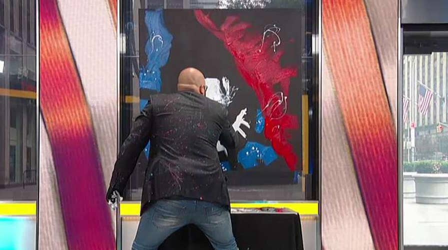 Painter sings 'God Bless the U.S.A.' while painting