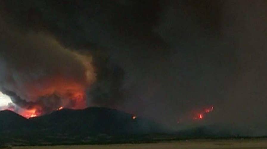 Dozens of wildfires raging in western states