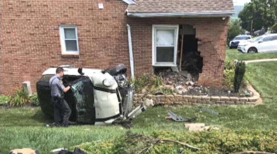 Raw video: Driver fleeing police crashes into house