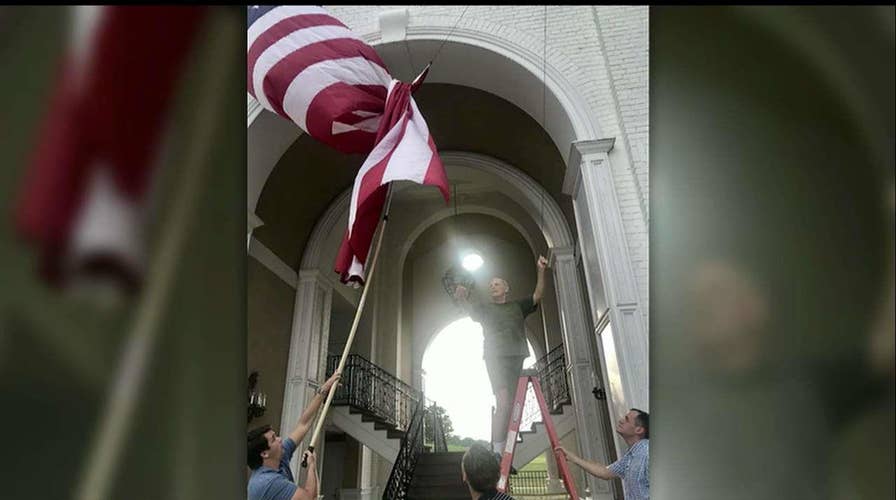 WH Chief of Staff John Kelly Untangles American Flag at Trump Golf Course