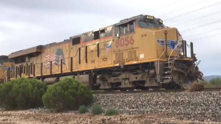 Train derails in Arizona during heavy rain, flooding
