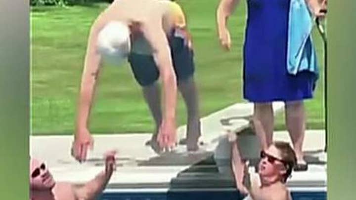 95-year-old veteran shows boy how to be brave with pool dive