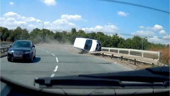Video: Out of control van grinds bridge barrier like skateboarder