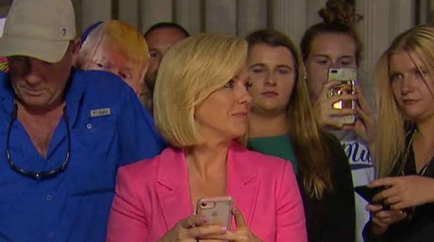 Protesters scream at Fox anchor