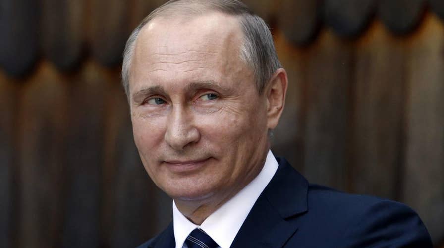 Should Trump be cautious of former KGB Putin?