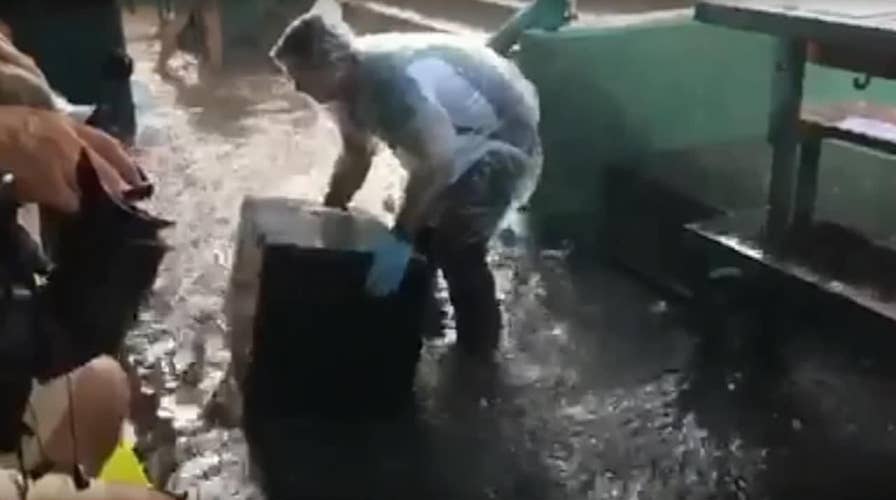 Torrential rain floods the Nationals' dugout