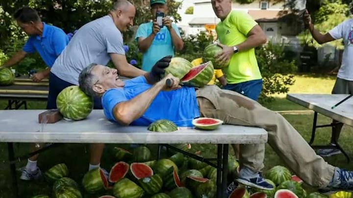 Man sets records for slicing watermelons on his stomach