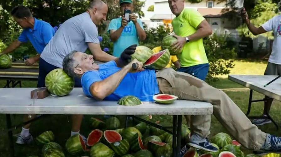 Man sets records for slicing watermelons on his stomach