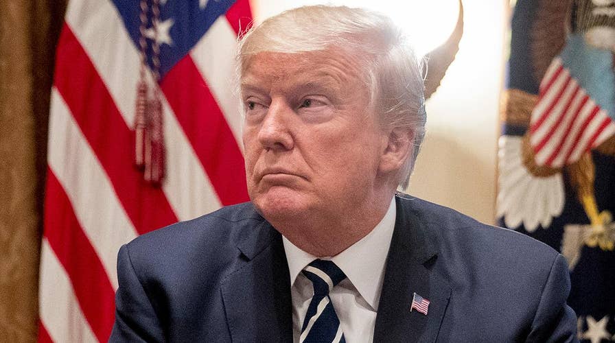 Trump attempts to extinguish criticism for Russia remarks