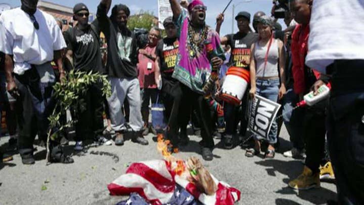 Protesters burn American flag outside Maxine Waters' office