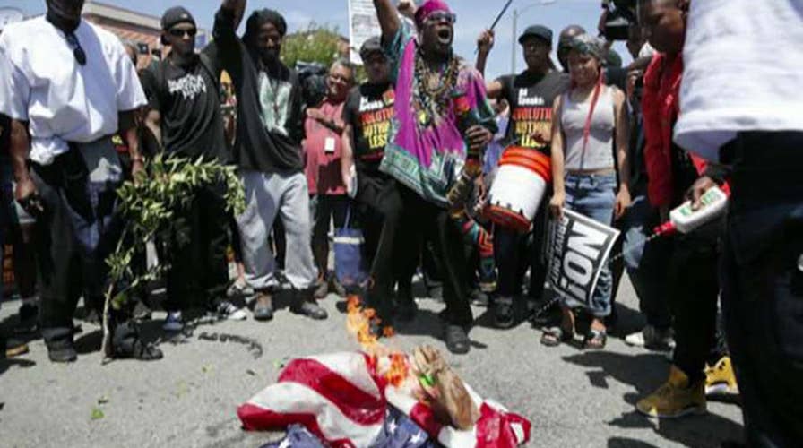 Protesters burn American flag outside Maxine Waters' office