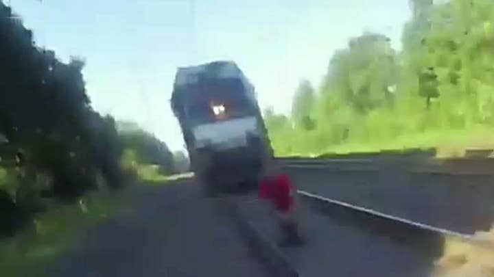 Cop saves man from being hit by train