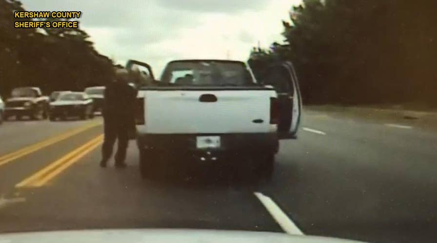 Police chase 'dead' driver's truck on foot to save his life
