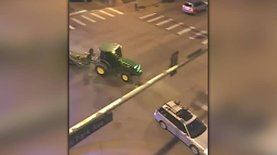 Raw video: Police pursue tractor through Denver