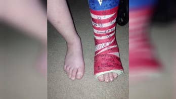 Boy in wheelchair pulls himself to feet for national anthem at Tennessee fair