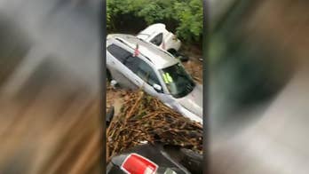 New Jersey flash floods send cars floating down river, piling up against bridge