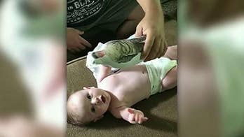 Video of baby's excited reaction to doll resembling military dad goes viral