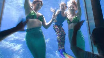 Girl with rare condition gets wish to swim with mermaids