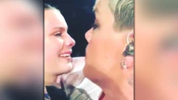 Pink stops concert to comfort 14-year-old girl who lost her mom: 'It was a hug from heaven'