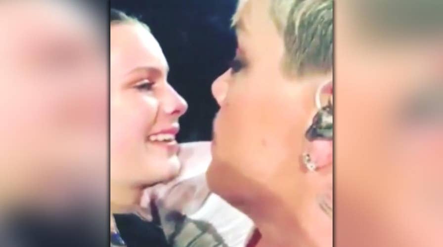 Raw video: Pink interrupts Brisbane show to comfort fan 