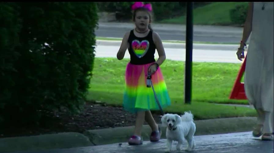 Neighbors call police after mom lets 8-year-old walk dog