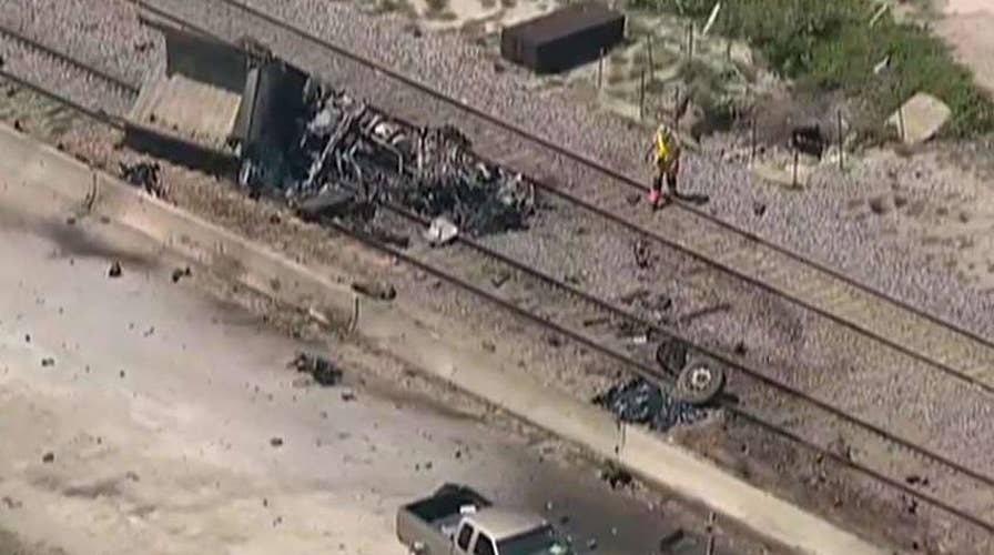 Crash involving dump truck, train leaves two dead