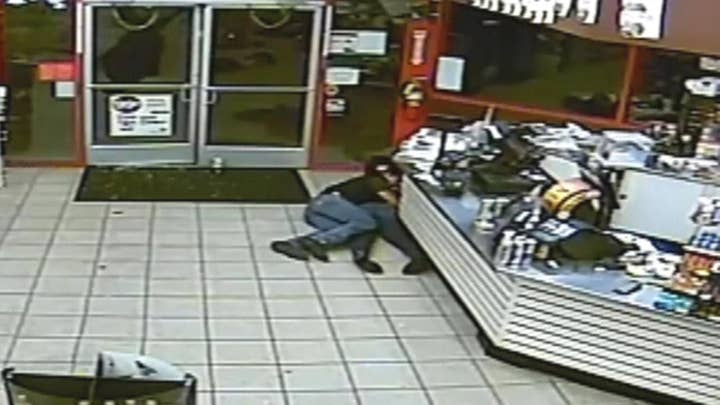 Firefighter shields woman from gunfire