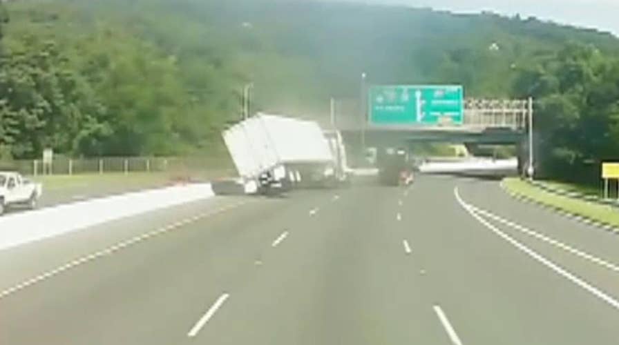 Tractor trailer tips over in apparent road rage incident