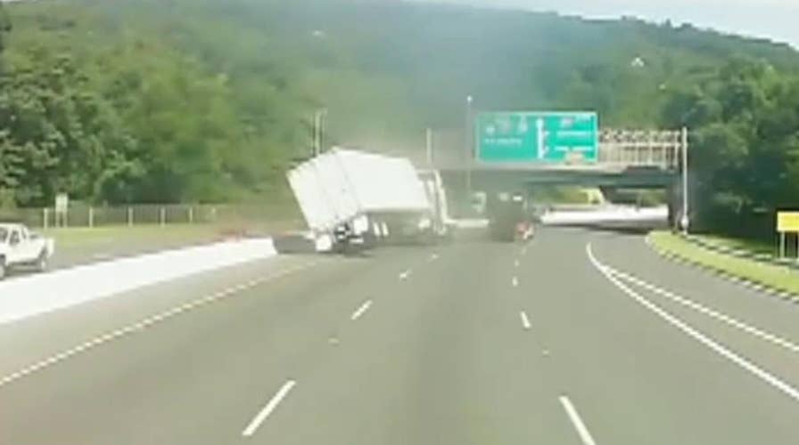 Tractor trailer tips over in apparent road rage incident