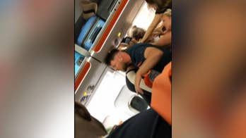 EasyJet passengers filmed fighting after woman allegedly gives in-flight lap dances while intoxicated